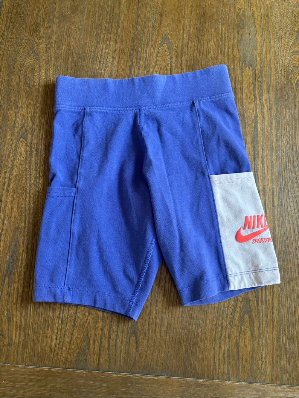Nike Purple Athletic Shorts with White Pocket and Red Logo